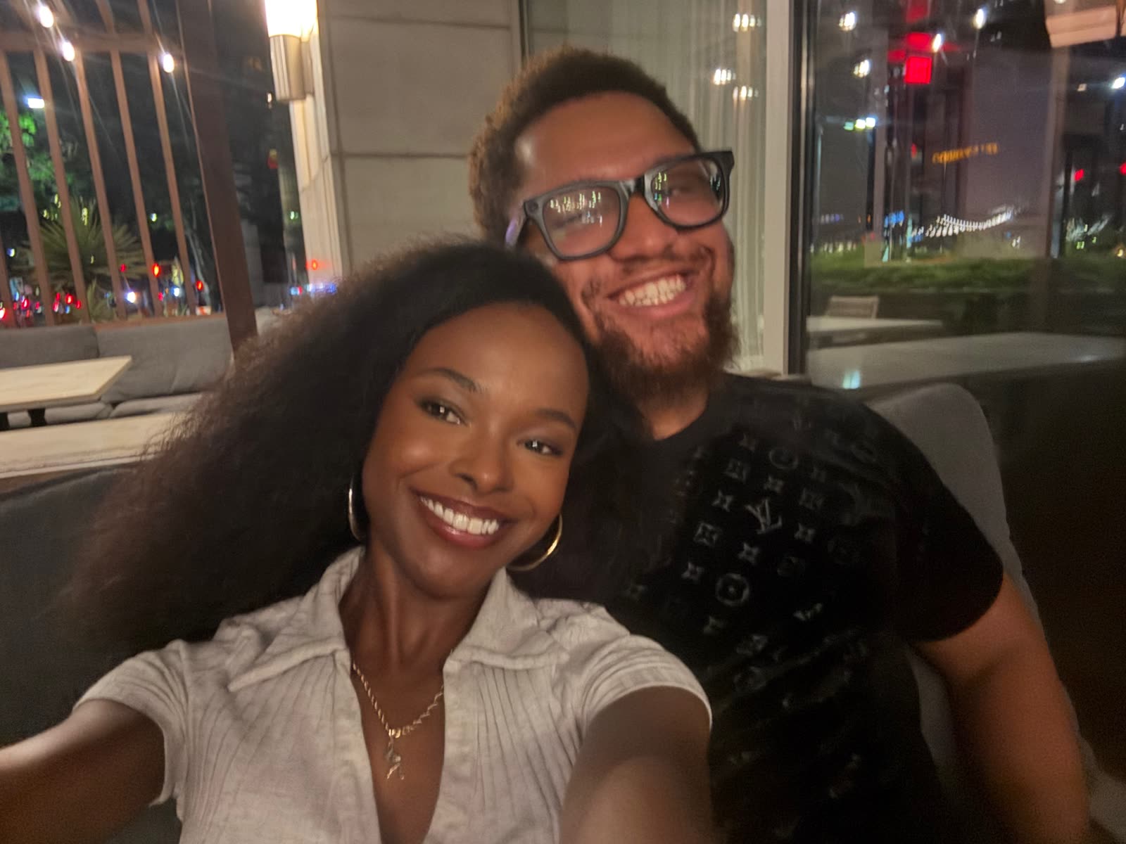 Tayllor and Austin smiling at dinner